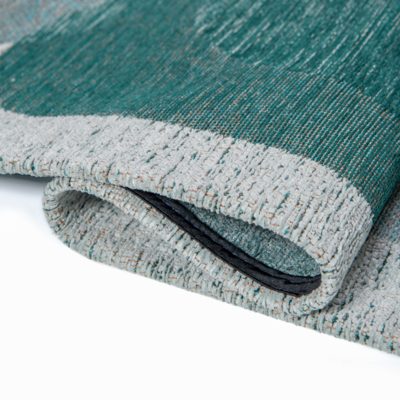 Groen en blauw tapijt met willekeurige, ronde vormen en een "Café" bonenmotief